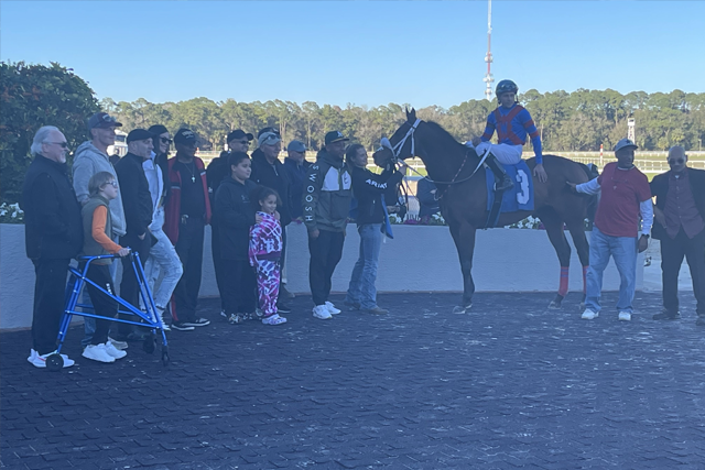 Our mascot, Christopher was pulled into the winner’s circle at the 8th race at Tampa Bay Downs